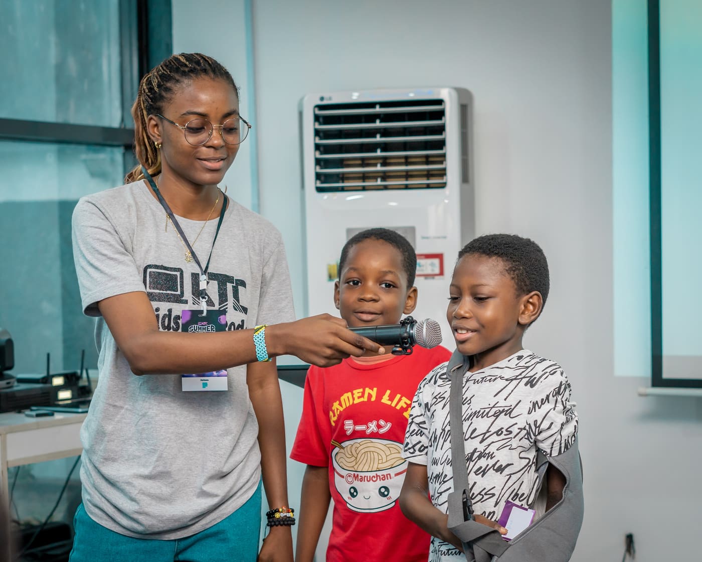 A KTC tutor guiding two young students