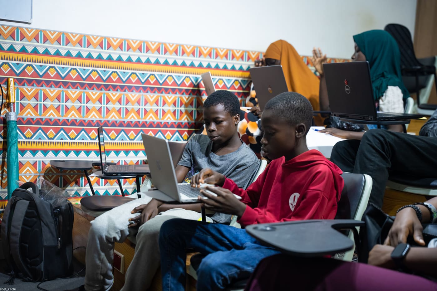 Students coding side by side in class