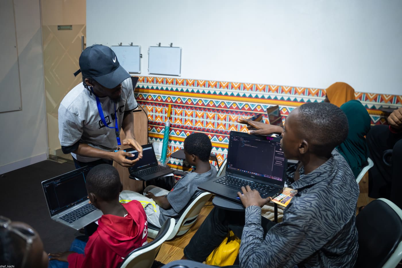 A mentor pointing out something on a student's screen
